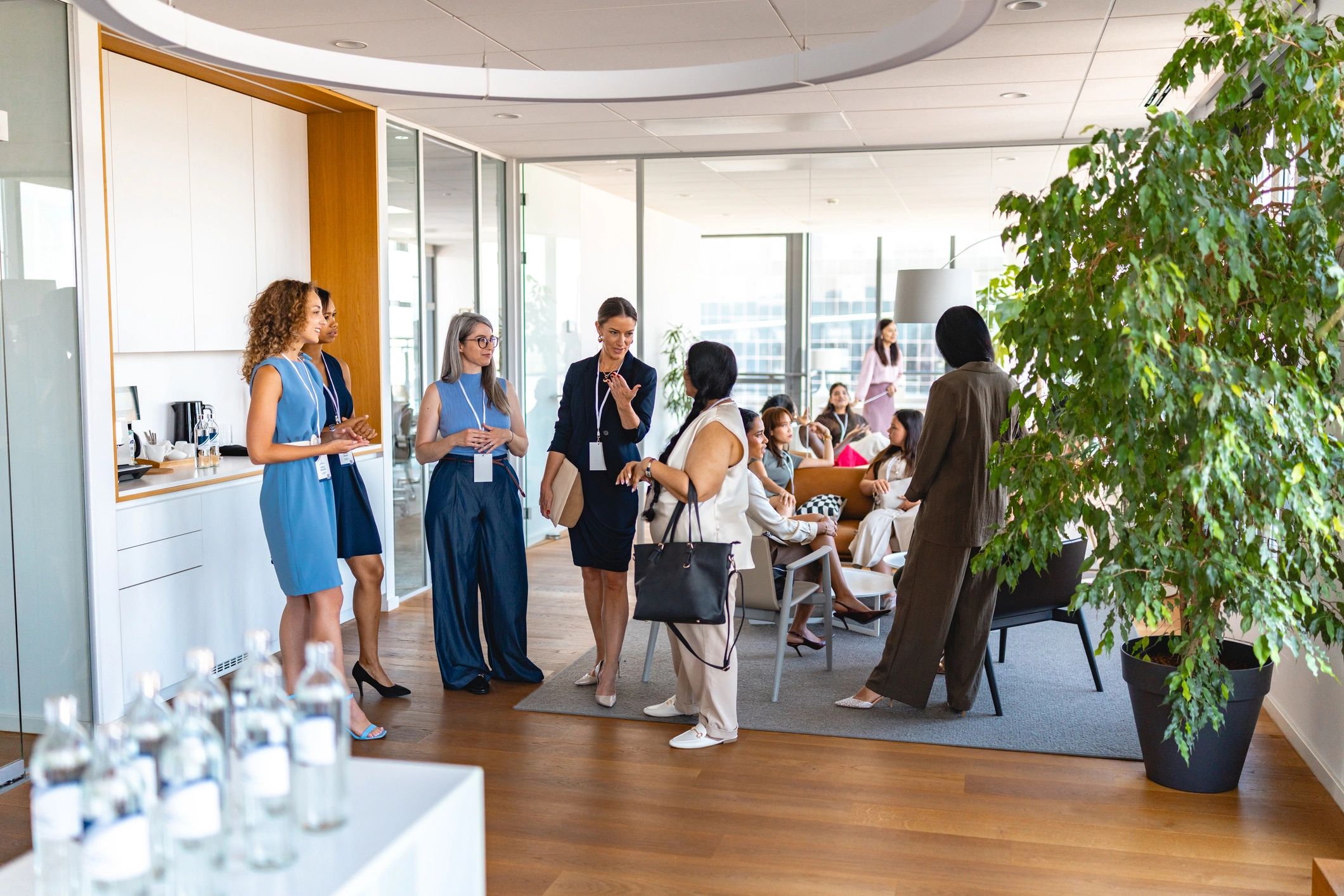 Retail team members talking together in a bright modern space